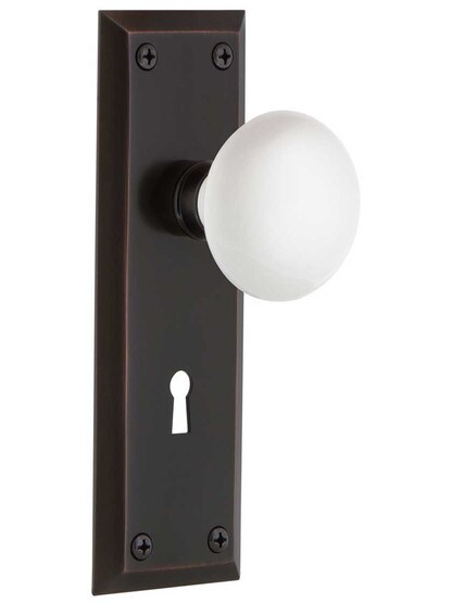 New York Mortise Lock Set With White Porcelain Door Knobs in Timeless Bronze.